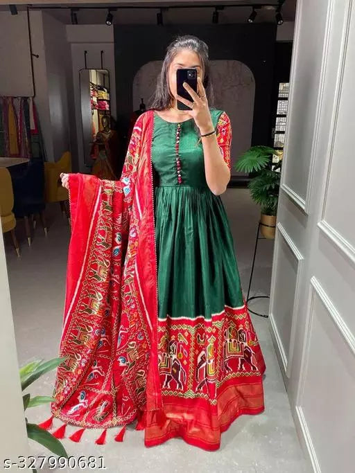 Stylish long gown for women perfect for weddings and traditional occasions. This Patola print long frock gown is ideal as a fancy party wear for ladies during Navratri.